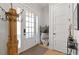 Inviting foyer with hardwood floors, coat rack, stylish decor, and ample natural light at 354 Milwaukee St, Denver, CO 80206