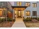 Inviting front entrance with a decorative door, manicured landscaping, and charming lighting at 354 Milwaukee St, Denver, CO 80206