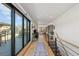Hallway with large sliding glass doors leading to an outdoor patio and stairway at 354 Milwaukee St, Denver, CO 80206