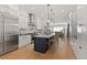 Bright kitchen featuring a large island, stainless steel appliances, and seamless open layout at 354 Milwaukee St, Denver, CO 80206