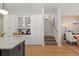Open-concept kitchen leading to the dining room with modern cabinets at 354 Milwaukee St, Denver, CO 80206
