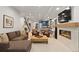 Finished basement with a fireplace, entertainment center, and a lounge area at 354 Milwaukee St, Denver, CO 80206