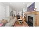 Cozy living room featuring a fireplace, stylish decor, and open access to the kitchen at 354 Milwaukee St, Denver, CO 80206