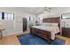 Serene main bedroom with a dark wood furniture, large windows and ceiling fan at 354 Milwaukee St, Denver, CO 80206