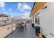 Outdoor roof deck with a table, chairs, and planters, with a view of the surrounding neighborhood at 354 Milwaukee St, Denver, CO 80206