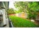Expansive backyard with lawn and privacy fence, perfect for outdoor enjoyment and activities at 9950 Sydney Ln, Highlands Ranch, CO 80130