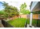 This is an expansive backyard with privacy fence, lawn and a playhouse at 9950 Sydney Ln, Highlands Ranch, CO 80130