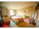 Cozy bedroom with colorful decor, and a window with curtains at 9950 Sydney Ln, Highlands Ranch, CO 80130