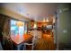 Warm and inviting kitchen with stainless steel appliances, wood floors and a dining area at 9950 Sydney Ln, Highlands Ranch, CO 80130