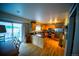 The kitchen boasts wood floors, stainless steel appliances, and sliding door access to the backyard at 9950 Sydney Ln, Highlands Ranch, CO 80130