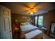 Cozy main bedroom with a bed, neutral carpet, and a ceiling fan at 9950 Sydney Ln, Highlands Ranch, CO 80130