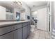 Clean, well lit bathroom with gray vanity and tile floors at 8671 E Dry Creek Rd # 721, Englewood, CO 80112