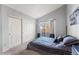 Bedroom with sliding door to balcony and large closet at 8671 E Dry Creek Rd # 721, Englewood, CO 80112