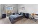 Comfortable bedroom with access to a private balcony at 8671 E Dry Creek Rd # 721, Englewood, CO 80112