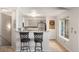 Kitchen with breakfast bar, neutral countertops, and stainless steel appliances at 8671 E Dry Creek Rd # 721, Englewood, CO 80112