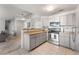 Modern kitchen with stainless steel appliances, light gray cabinets, and neutral countertops at 8671 E Dry Creek Rd # 721, Englewood, CO 80112