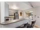 Kitchen with stainless steel appliances, breakfast bar and modern finish at 8671 E Dry Creek Rd # 721, Englewood, CO 80112