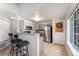 Kitchen with stainless steel appliances, breakfast bar, and ample counter space at 8671 E Dry Creek Rd # 721, Englewood, CO 80112