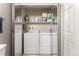 Laundry room with washer, dryer and mirrored walls at 8671 E Dry Creek Rd # 721, Englewood, CO 80112