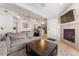 Comfortable living room features a fireplace, ceiling fan and TV at 8671 E Dry Creek Rd # 721, Englewood, CO 80112