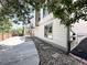 Exterior view showing a concrete patio, stairs to a second-story deck, and a well-manicured backyard at 17037 E Wiley Pl, Parker, CO 80134