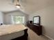 Bedroom featuring vaulted ceiling, ceiling fan, and large window at 17037 E Wiley Pl, Parker, CO 80134