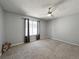 Cozy bedroom with large window and ceiling fan at 17037 E Wiley Pl, Parker, CO 80134