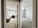 View of two bright bedrooms with carpeted floors and ceiling fans through a doorway at 17037 E Wiley Pl, Parker, CO 80134