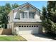 Two-story house with attached garage and landscaping at 17037 E Wiley Pl, Parker, CO 80134