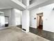 Spacious living room with carpet and hardwood flooring, complemented by natural light and neutral color palette at 17037 E Wiley Pl, Parker, CO 80134