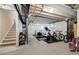 Unfinished basement perfect for storage or a home gym with stairs and exposed ceiling at 8586 Holman Ct # A, Arvada, CO 80005