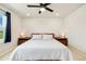 Bright bedroom features a ceiling fan, neutral walls, and modern nightstands at 8586 Holman Ct # A, Arvada, CO 80005