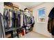Walk-in closet with window, shelving and closet organization system at 8586 Holman Ct # A, Arvada, CO 80005