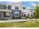 Charming two-story home featuring a welcoming front porch, attractive landscaping, and a well-maintained lawn at 8586 Holman Ct # A, Arvada, CO 80005