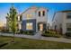 Charming two-story home with blue and white exterior, small front yard, and well-maintained landscaping at 8586 Holman Ct # A, Arvada, CO 80005