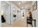 Neutral hallway with multiple doorways with beige carpet and white trim at 8586 Holman Ct # A, Arvada, CO 80005