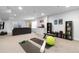 Spacious finished basement with a workout space, storage, and entertainment area at 8775 El Diente St, Arvada, CO 80007