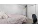 Simple bedroom includes a comfy bed, closet, and access to an adjoining bathroom at 8775 El Diente St, Arvada, CO 80007