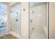 Modern bathroom showcasing dual glass-enclosed showers with white subway tile and sleek fixtures at 1148 Sunlit Dr, Castle Rock, CO 80109