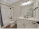 Modern bathroom featuring white subway tile in shower, with sleek black fixtures, and a contemporary white vanity at 1148 Sunlit Dr, Castle Rock, CO 80109