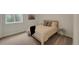 Cozy bedroom with a comfortable bed, neutral decor, and natural light from the window at 1148 Sunlit Dr, Castle Rock, CO 80109