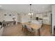Open-concept dining area connecting seamlessly with a modern kitchen and inviting living space at 1148 Sunlit Dr, Castle Rock, CO 80109