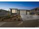 Beautiful single-story home featuring a three-car garage, stone accents, and professional landscaping at 1148 Sunlit Dr, Castle Rock, CO 80109