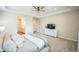 Comfortable main bedroom featuring a ceiling fan and access to the ensuite bathroom at 1148 Sunlit Dr, Castle Rock, CO 80109