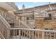 Exterior view featuring brick siding, wood railings, and steps leading to a front entrance at 2190 S Holly St # 207, Denver, CO 80222