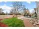 Inviting backyard patio with outdoor seating, lush lawn, and a charming landscape design at 2085 E 127Th Pl, Thornton, CO 80241