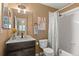 Well-lit bathroom with updated vanity, shower, and decor at 2085 E 127Th Pl, Thornton, CO 80241