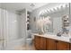 Bright bathroom with tub/shower combo and vanity at 2085 E 127Th Pl, Thornton, CO 80241