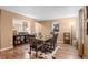 Elegant dining room featuring hardwood floors, sophisticated decor, and seamless transition to adjacent living spaces at 2085 E 127Th Pl, Thornton, CO 80241