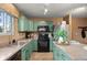 Bright kitchen featuring plenty of cabinets and stainless steel appliances providing generous storage and functionality at 2085 E 127Th Pl, Thornton, CO 80241